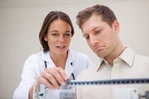 Doctor and scale, should you work with a doctor to lose weight